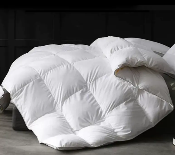 لماذا تستخدم الفنادق الراقية لحاف لأسفل؟